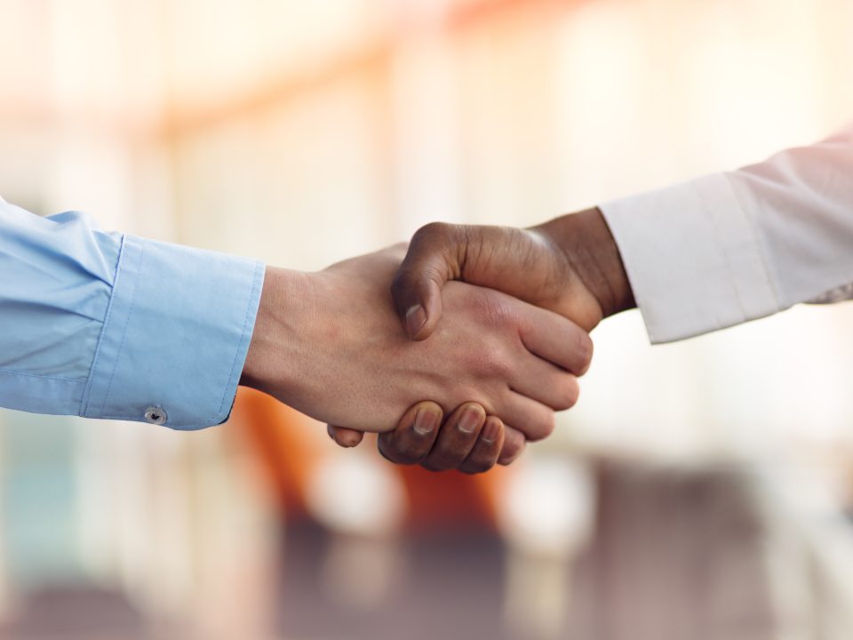 handshake between 2 people